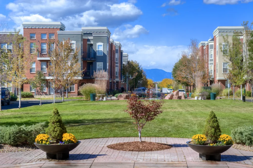 Tree lined residential street with view of mountains