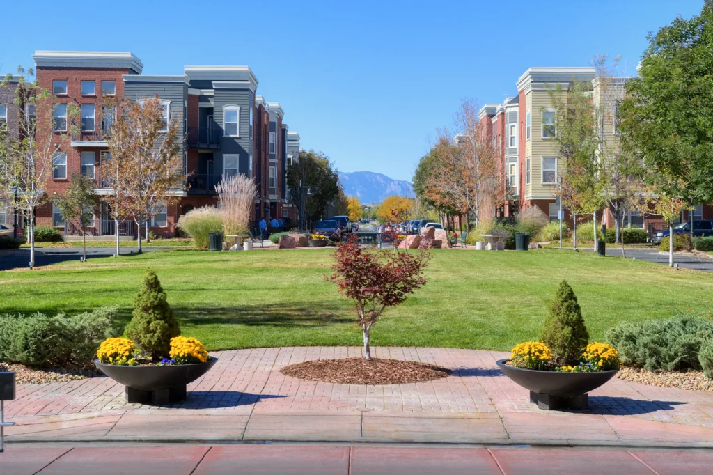 Tree lined residential street with view of mountains