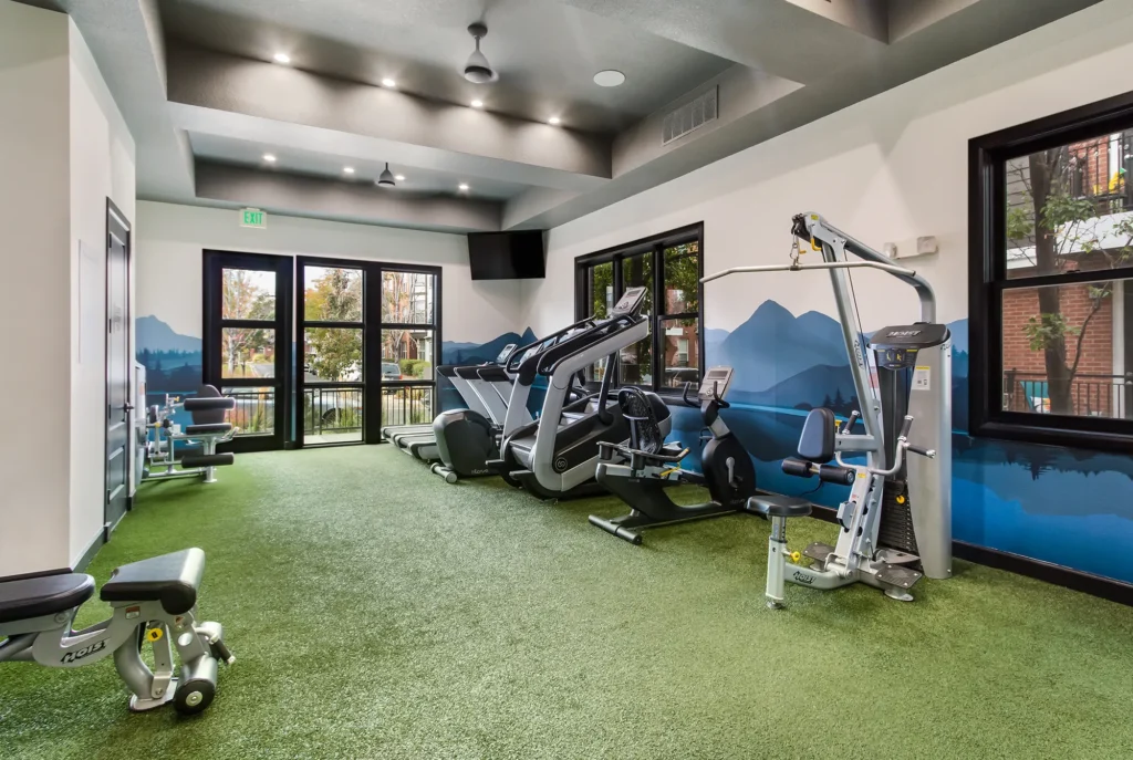 Fitness center with free weights, machines, and cardio equipment