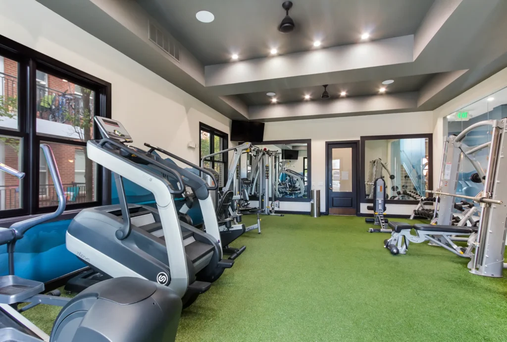 Fitness center with free weights, machines, and cardio equipment